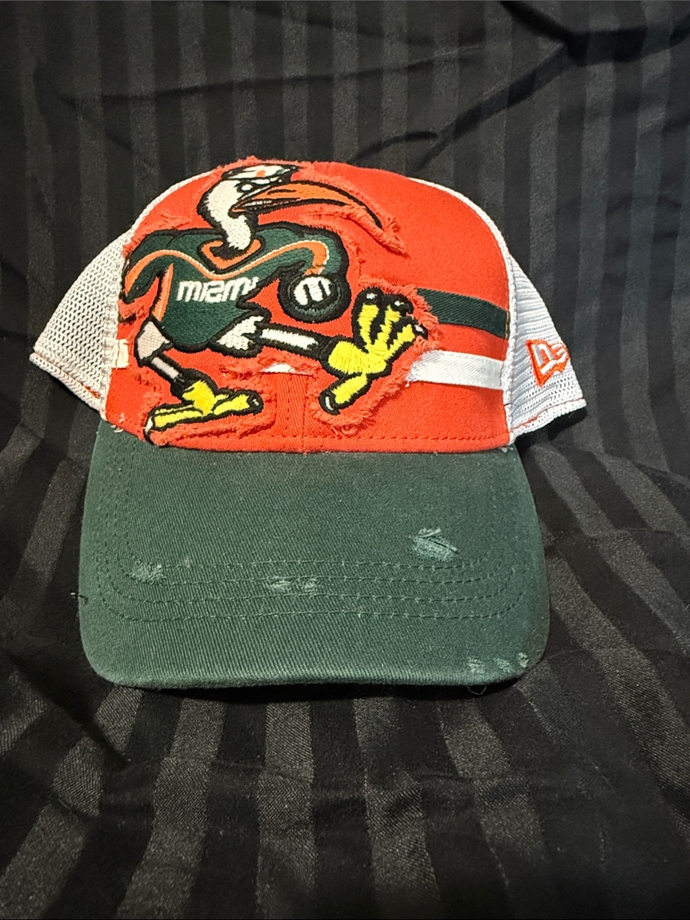New Era Black & White Trucker Hat with Team Patch